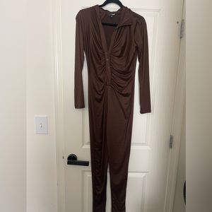 Fashion nova jumpsuit in brown. Never worn but tag is missing